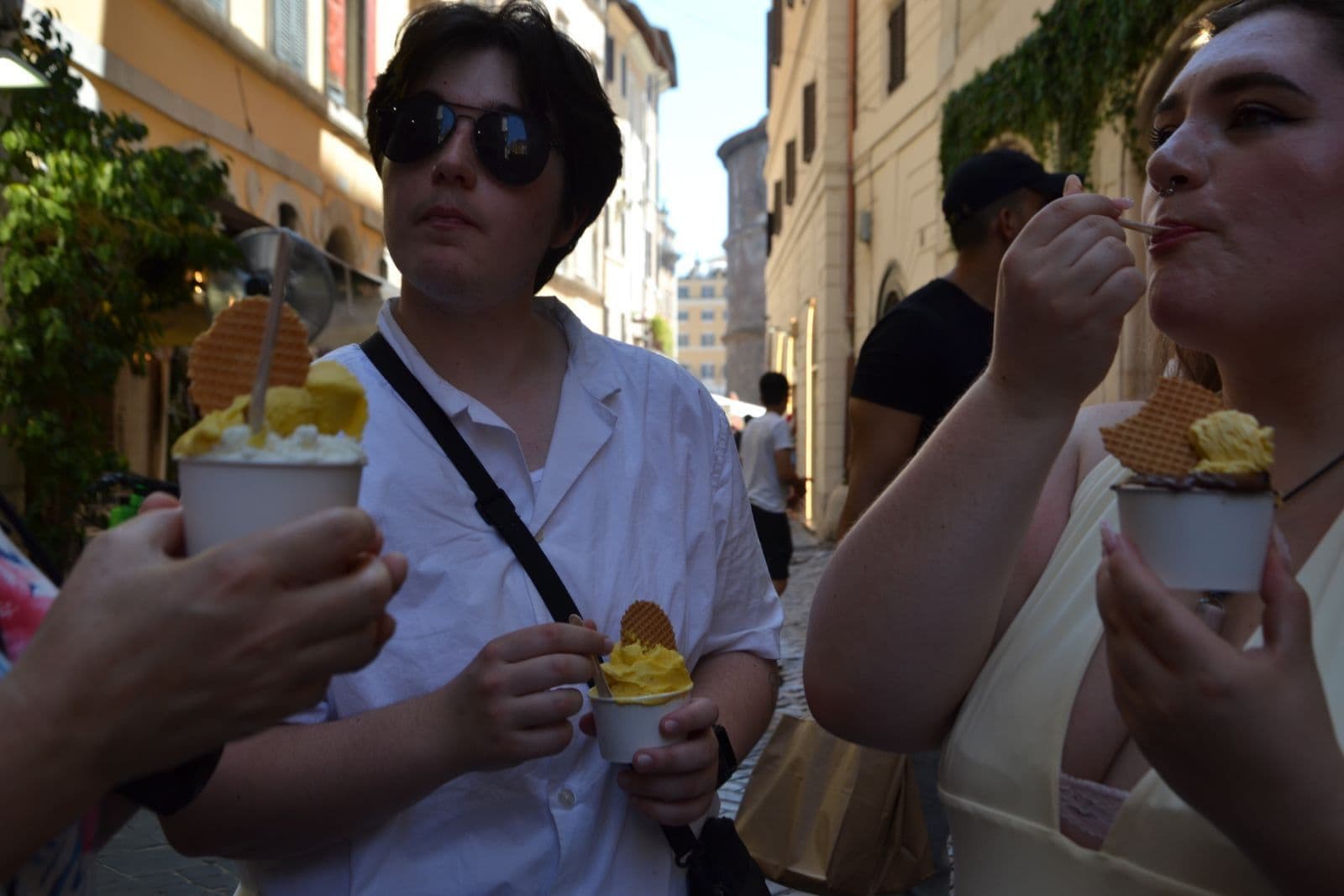 Guests eating gluten-free gelato on a street in Rome