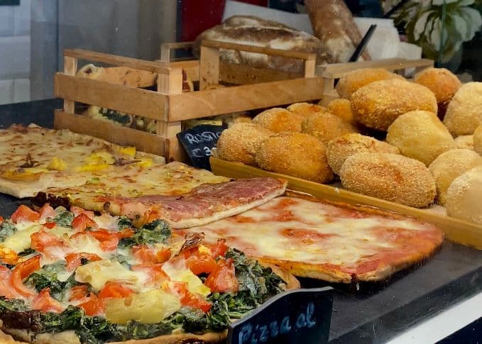 Roman pizza al taglio and fried supplì at a gluten-free food stop