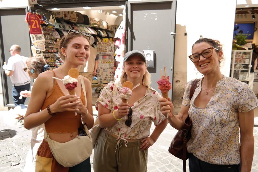 Three guests holding gluten-free gelato on a private food tour in Rome